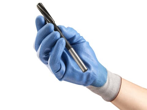 Hand wearing HyFlex 11-518 glove, holding a drill bit