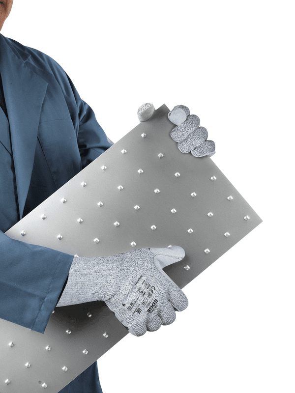 Worker wearing EDGE® 48-703 mechanical gloves holding a perforated metal sheet