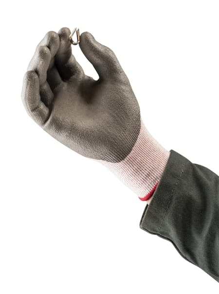 Hand wearing HyFlex 11-644 gloves, holding a mechanical component