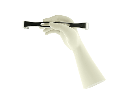 Gloved hand holding small retractor to show glove provides enhanced grip when holding surgical tools