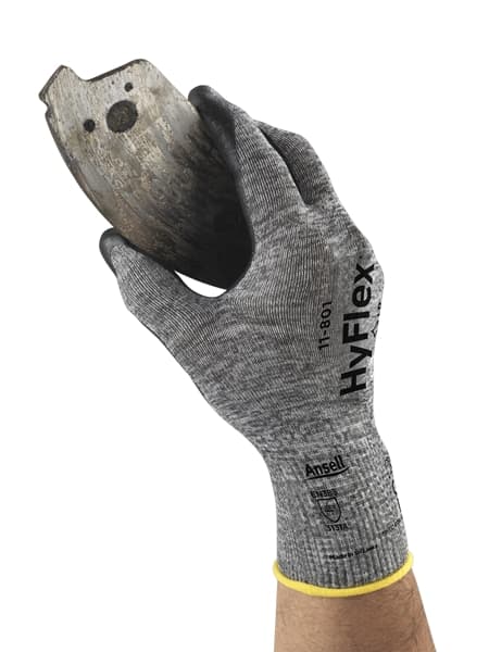 Hand wearing HyFlex 11-801 gloves, holding a mechanical component